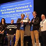 Two participants holding a trophy and standing beside 3 Quebec region representatives.