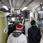 Tour group walking through the treatment plant.