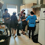 Hopedale residents in a kitchen at a local cooking class.