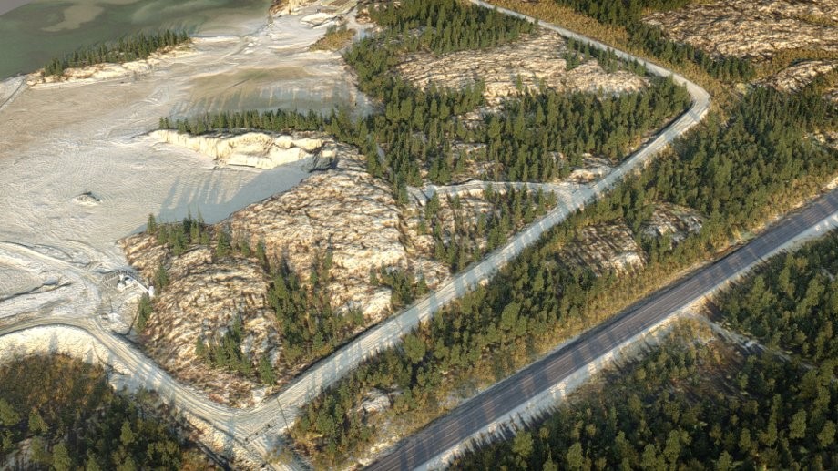 This image shows an aerial illustration of a potential borrow area on the Giant Mine site. Tailings are on the left side of the photo.  A dirt road traverses in between the outcrop and trees mid-photo, and a paved road is visible on the right side of the photo, with trees on either side.