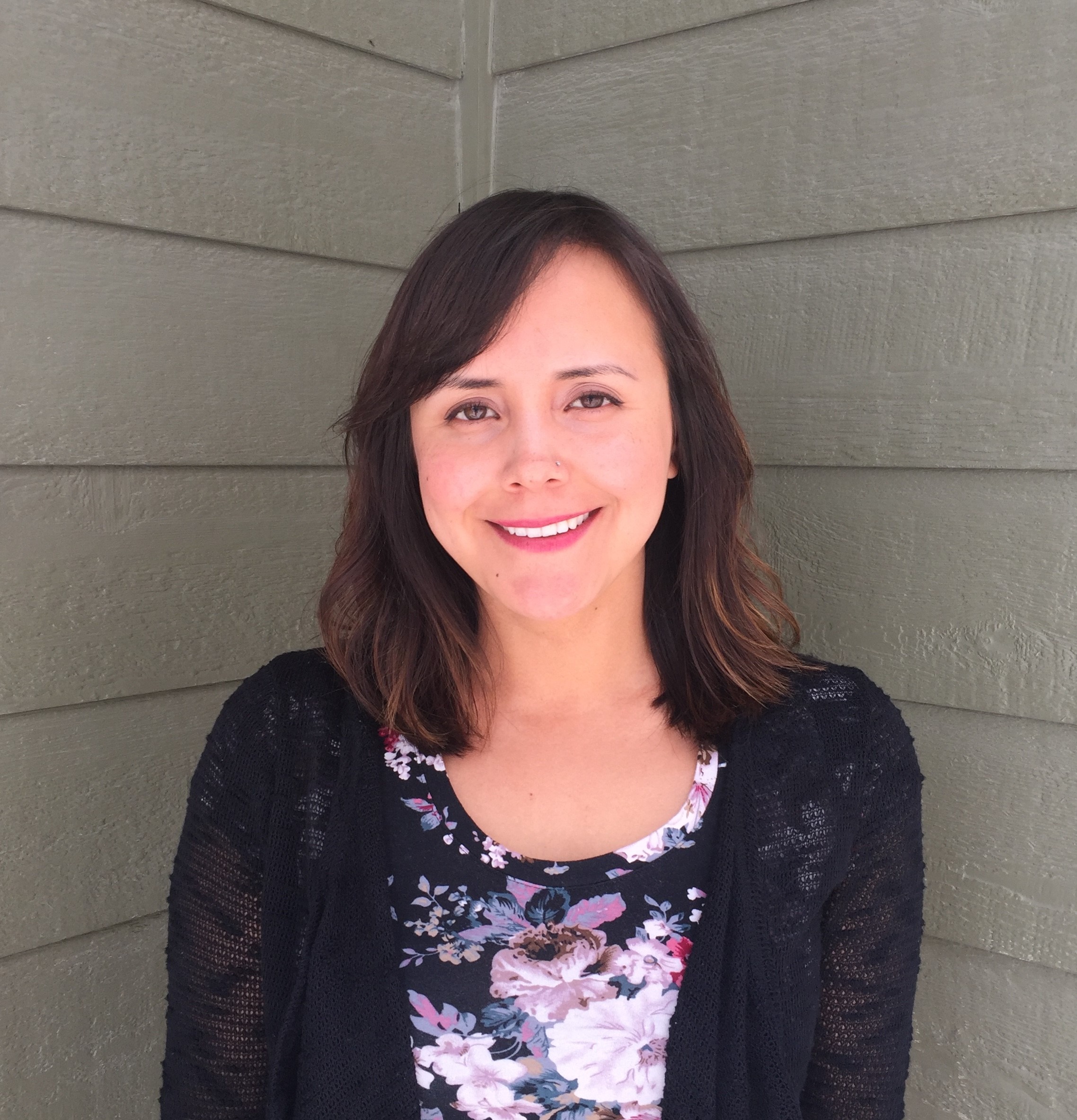 This picture is of Joanne Speakman standing in front of a neutral background.