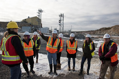 This picture shows a group of people in personal protective equipment on the Giant Mine site.